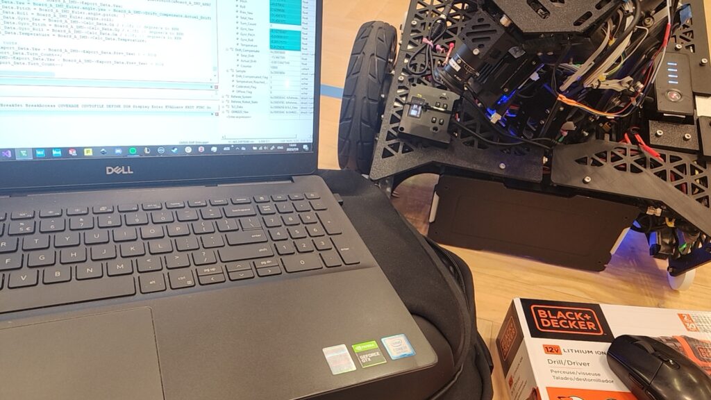 Team members debugging robots late in the competition.