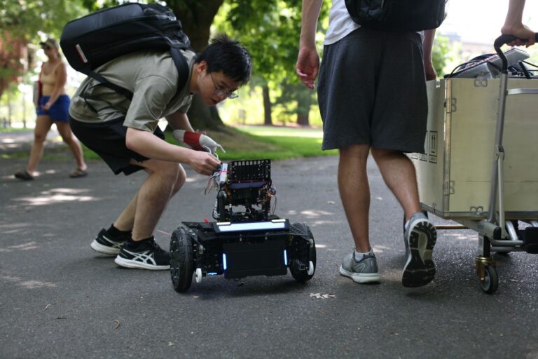 Yuxi with the RoboMaster robot at the 2023 competition.