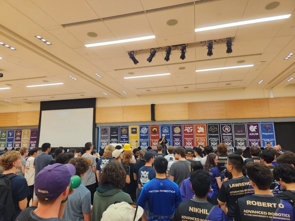 Audience and teams watching the RoboMaster competition.