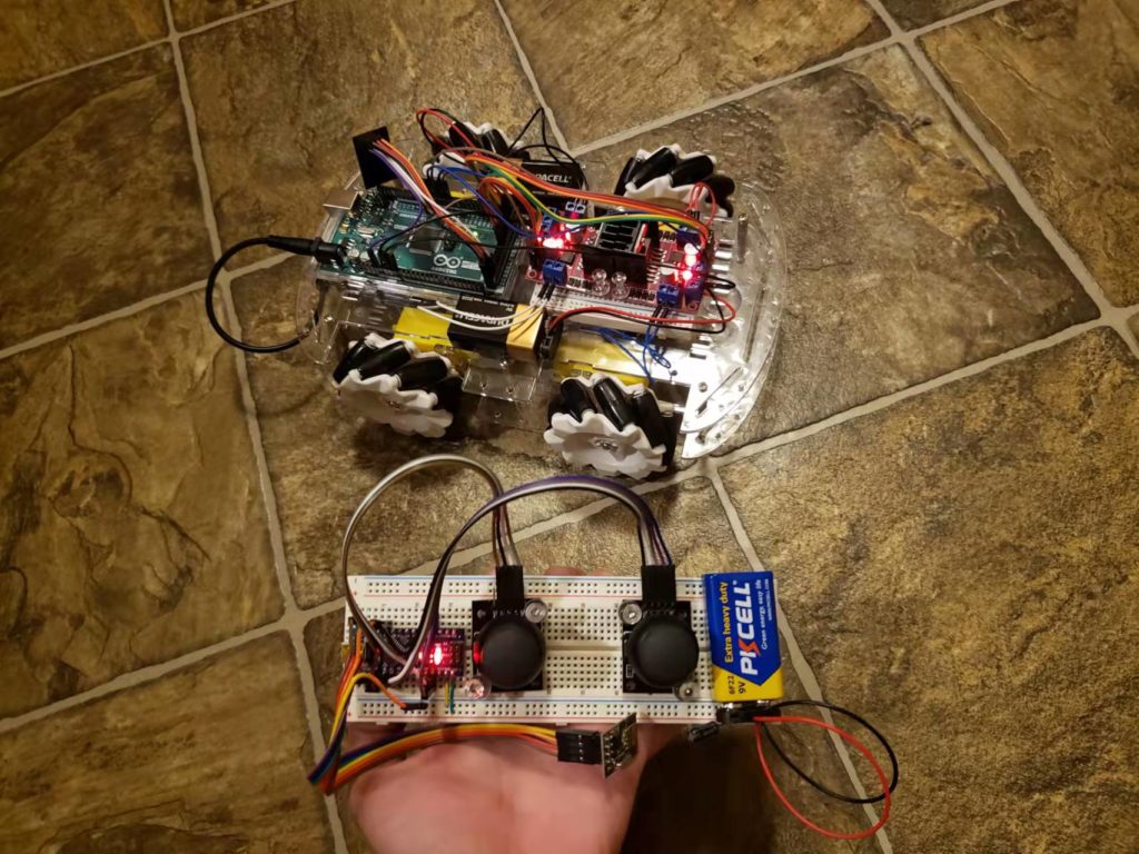 Arduino mecanum wheel car prototype with four mecanum wheels and exposed wiring.