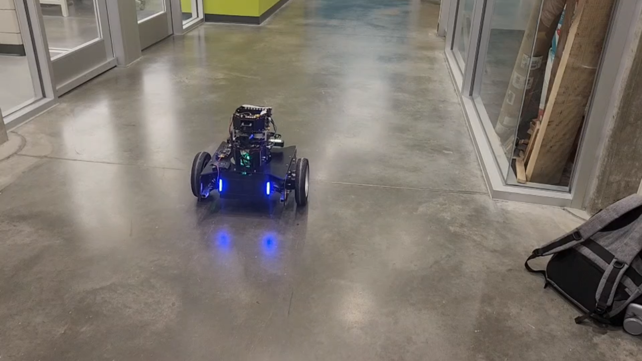 RoboMaster 2023 two-wheeled self-balancing standard robot driving indoors.