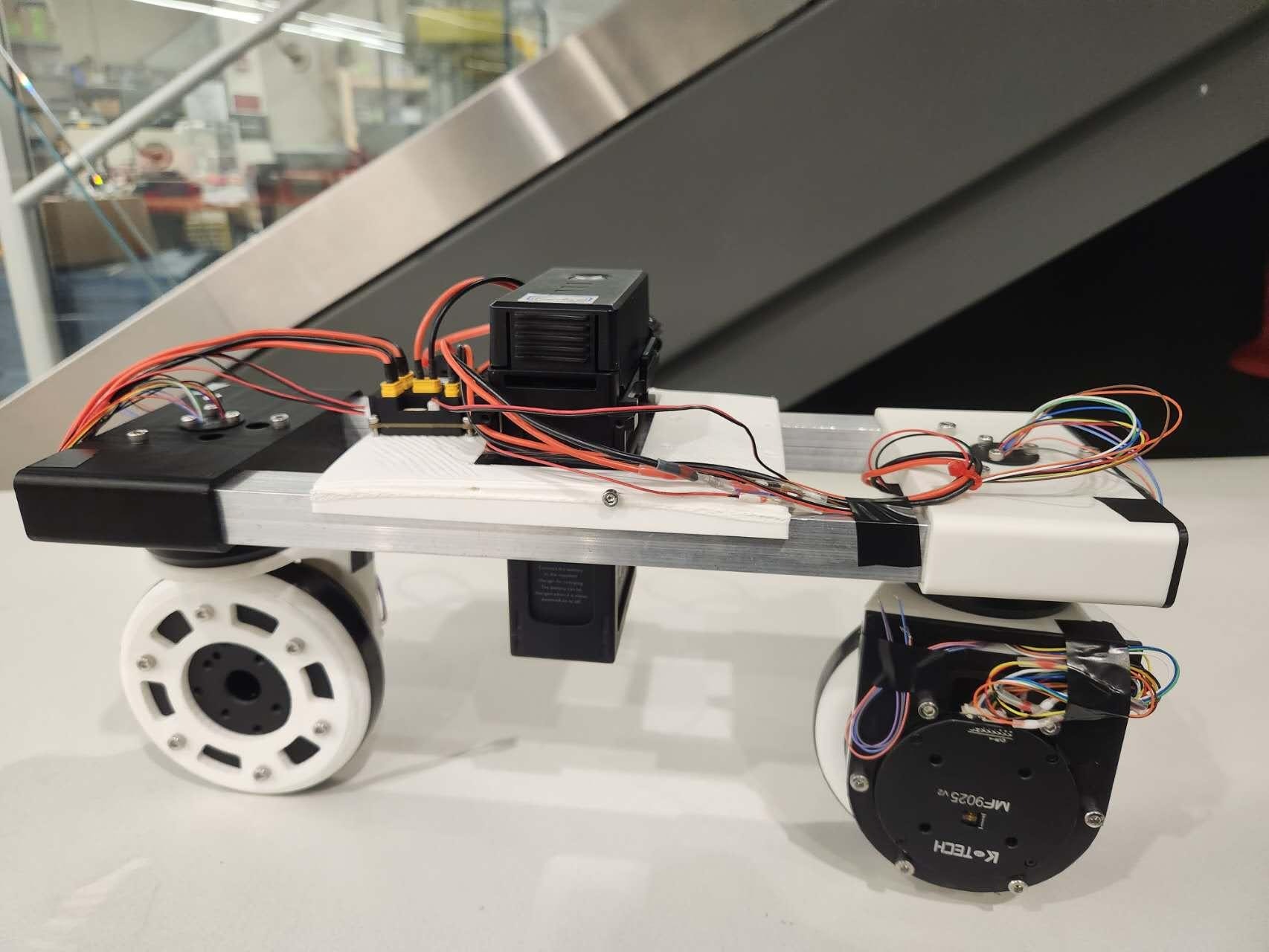 Swerve-drive balancing robot prototype sitting on a table.